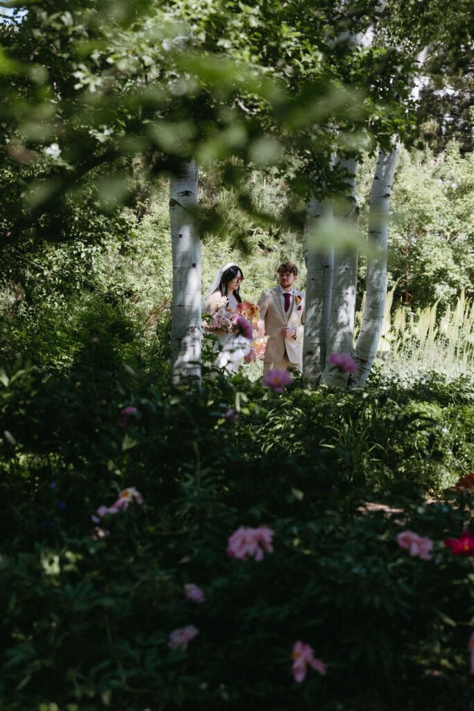 Couple entering wedding at the Denver Botanic gardens