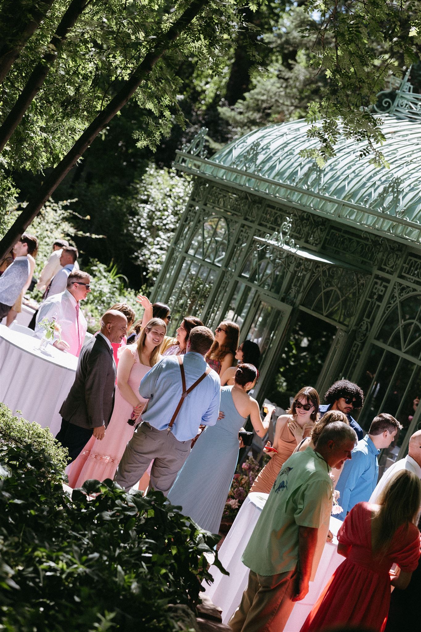 Guests mingling at Denver Botanic gardens during wedding