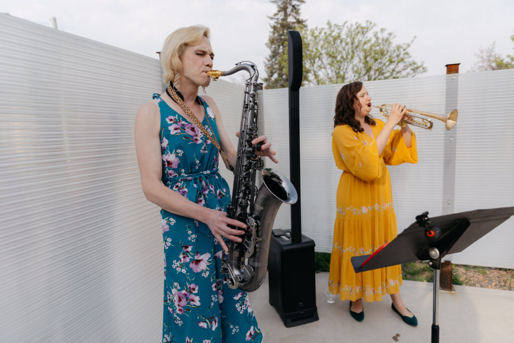 saxophonists playing sax during wedding cocktail hour