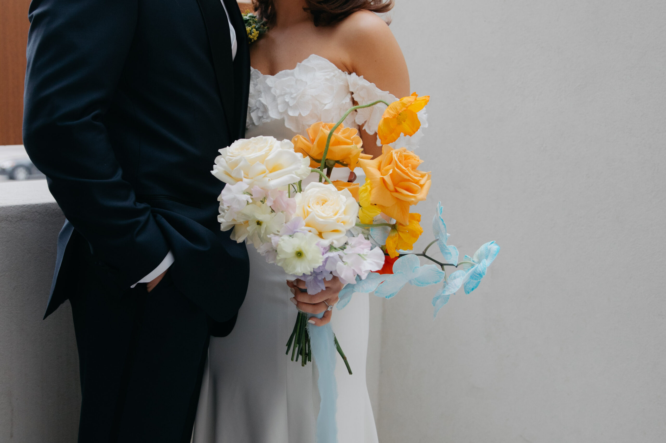 Colorful bouquet being held by bride