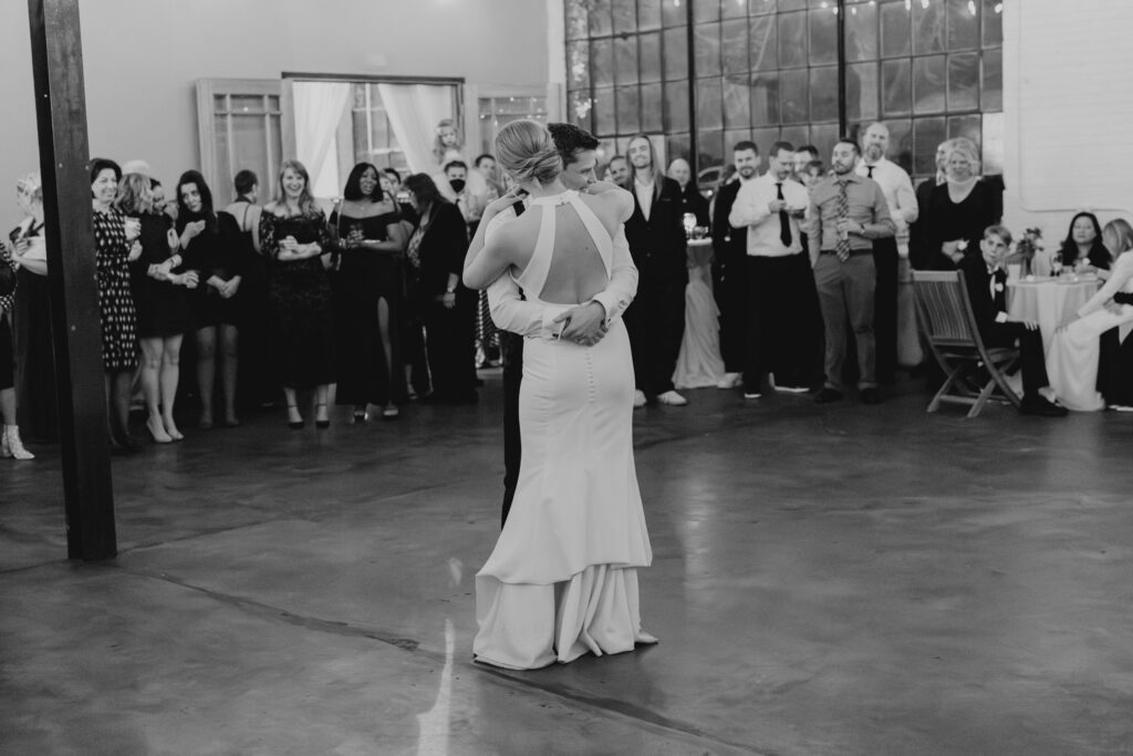 Bride and groom embracing during first dance after Denver wedding