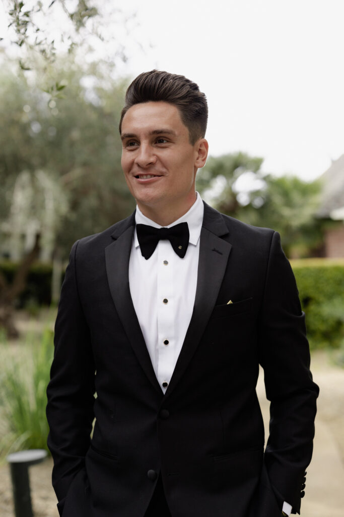 Groom in black tux during wedding at the Estate Yountville