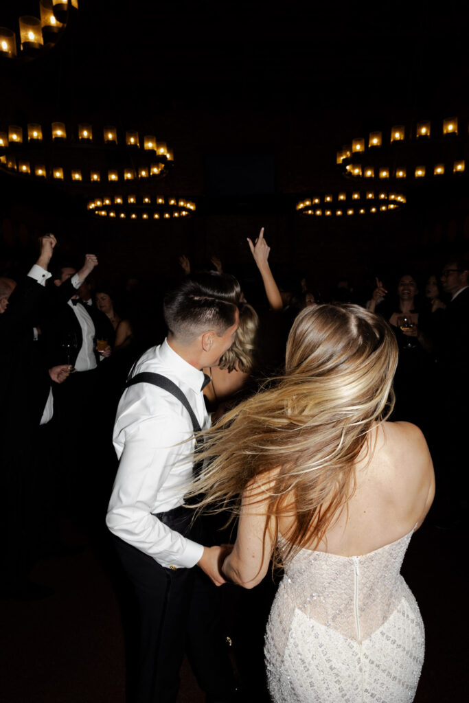 Direct flash highlighting bride and groom dancing during wedding at the Estate Yountville