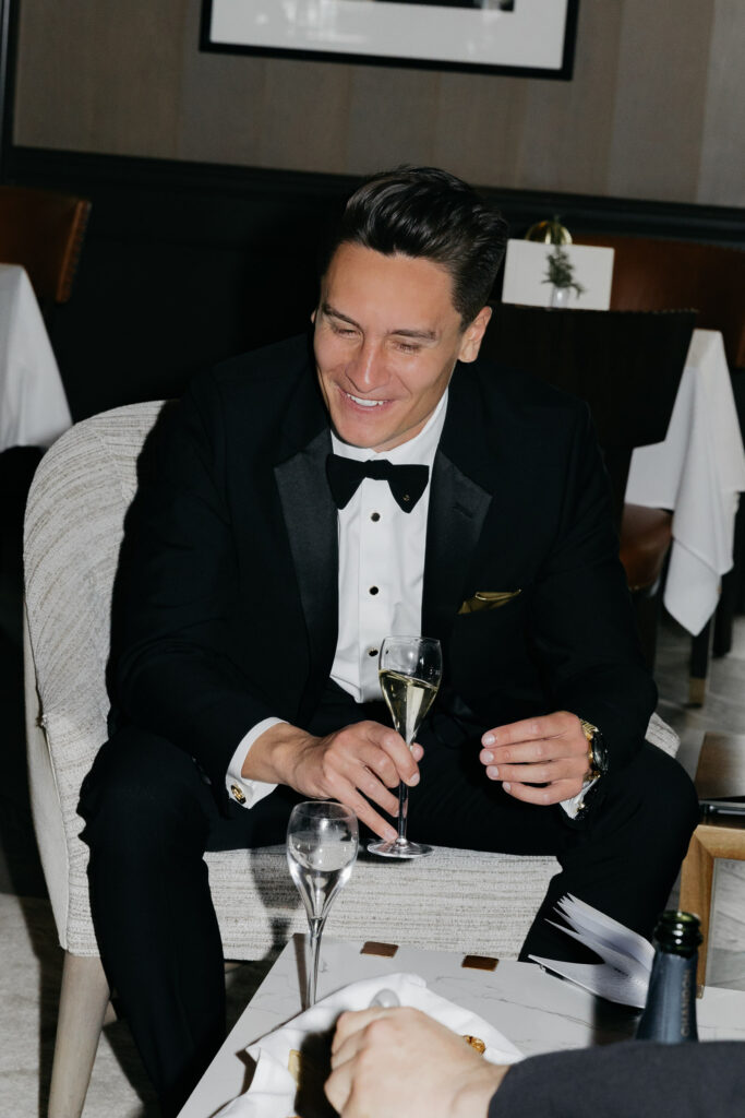 Groom sits inside Hotel Villagio at the Estate Yountville before wedding