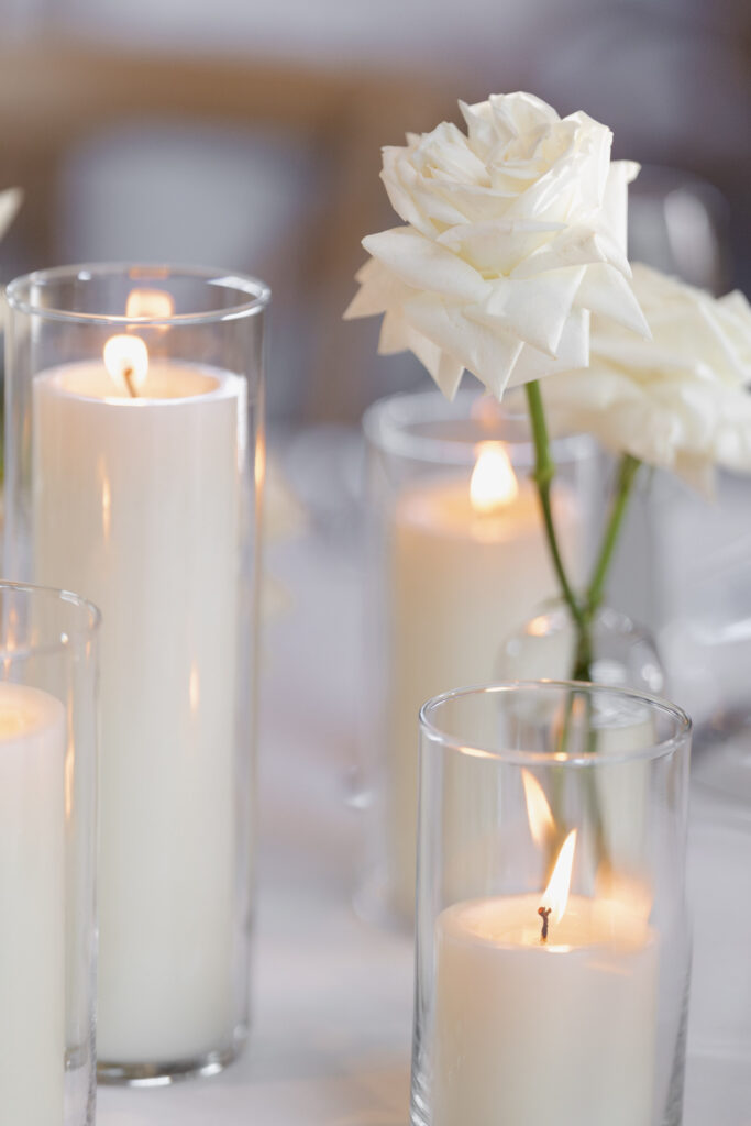 White roses as table accents on tables at the Estate yountville wedding
