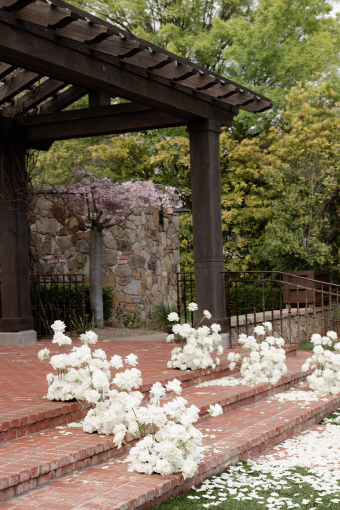 Roses line ceremony site at the Estate Yountville wedding