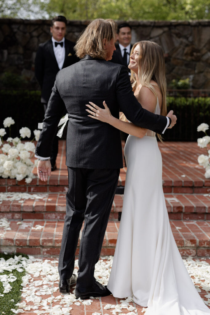 Bride hugs father during wedding at the Estate Yountville