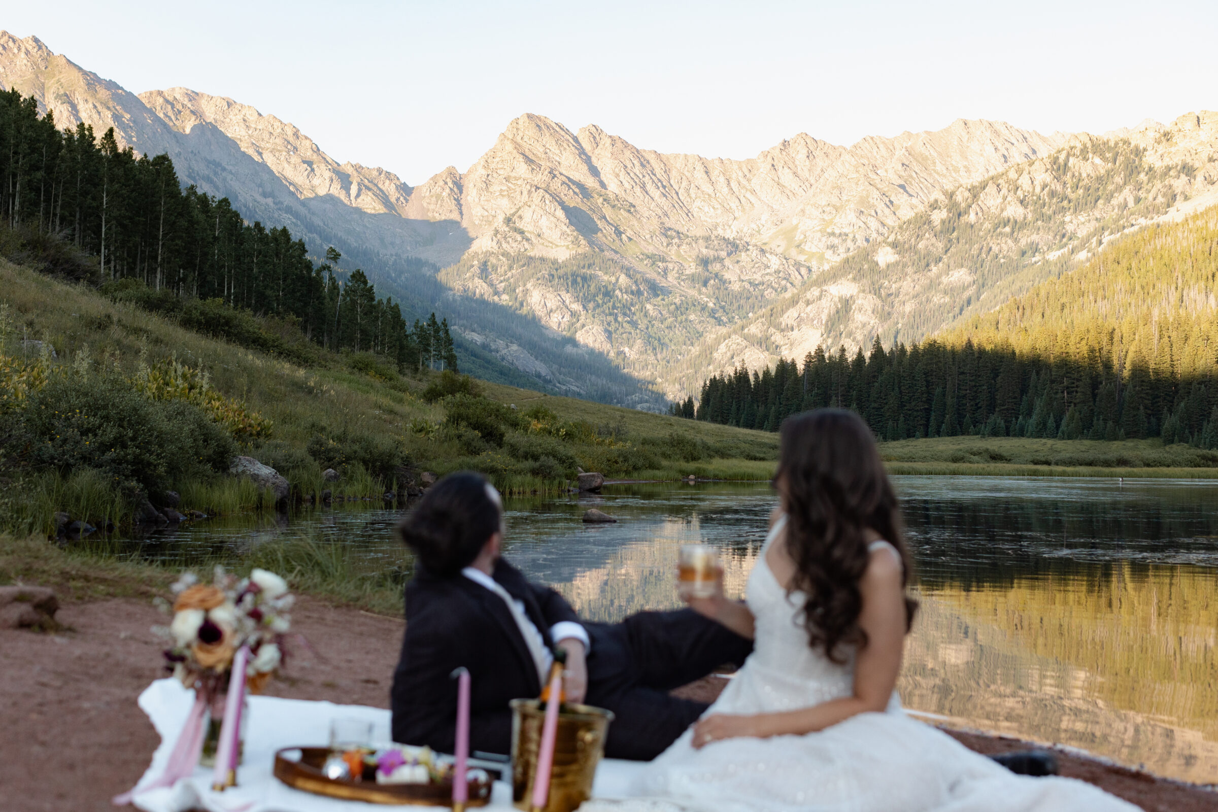 Couple looking at mountain backdrop during Piney River Ranch elopement