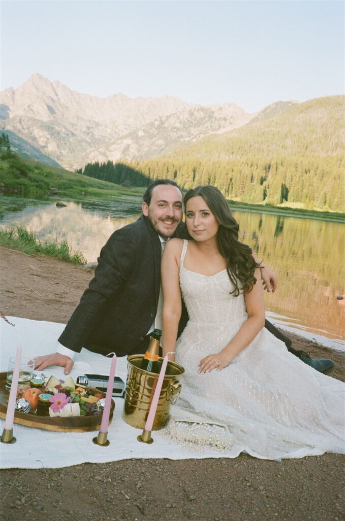 Couple enjoy picnic after elopement at Piney River Ranch