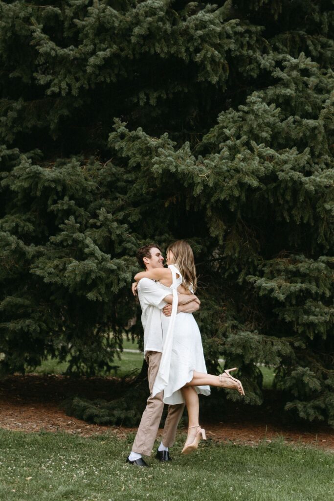 Couple dancing at Cheesman park during engagement photos