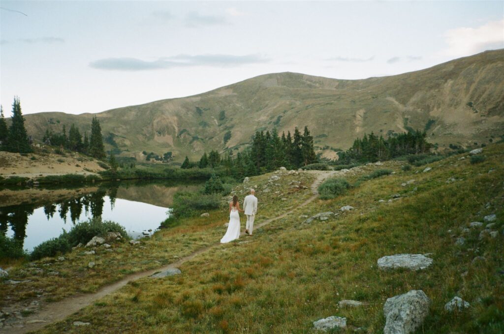 Couple surrounded by mountains during Loveland Pass in Colorado elopement