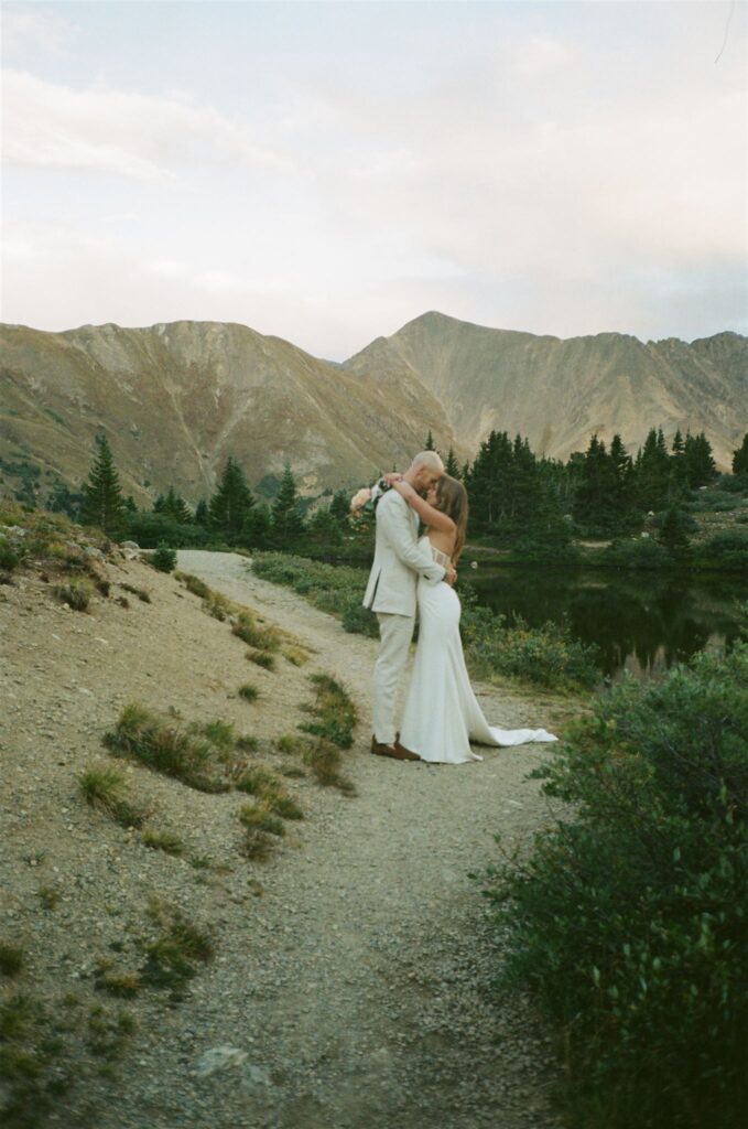 Bride and groom embrace during Colorado elopement at Loveland pass